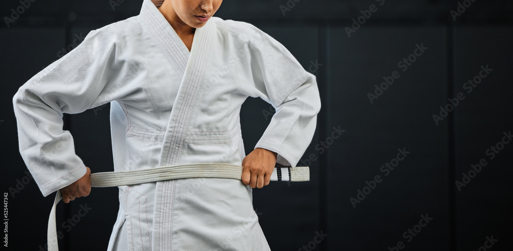 Canvas Prints .Beginner, karate and student getting ready for the first day of self defense training against a dark background in a dojo. Determined learner in motivation for fighting lessons in the martial arts.