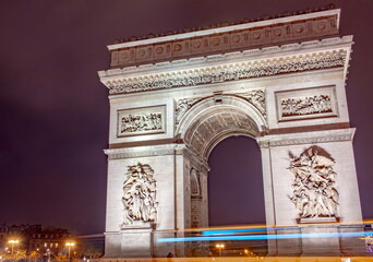 Evening lights at the Arc de Triomphe at Paris France at night