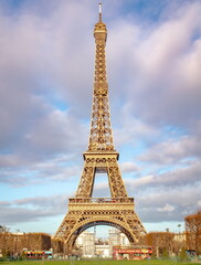Romantic Eiffel Tower on a blue cloudy Paris France Morning	