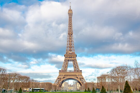 Romantic Eiffel Tower on a blue cloudy Paris France morning