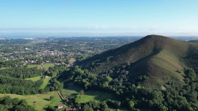Region of Ascain France with town and mountain near the French and Spanish border, Aerial flyover shot