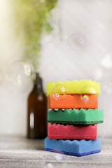 stack dish washing sponges and soap bubbles 