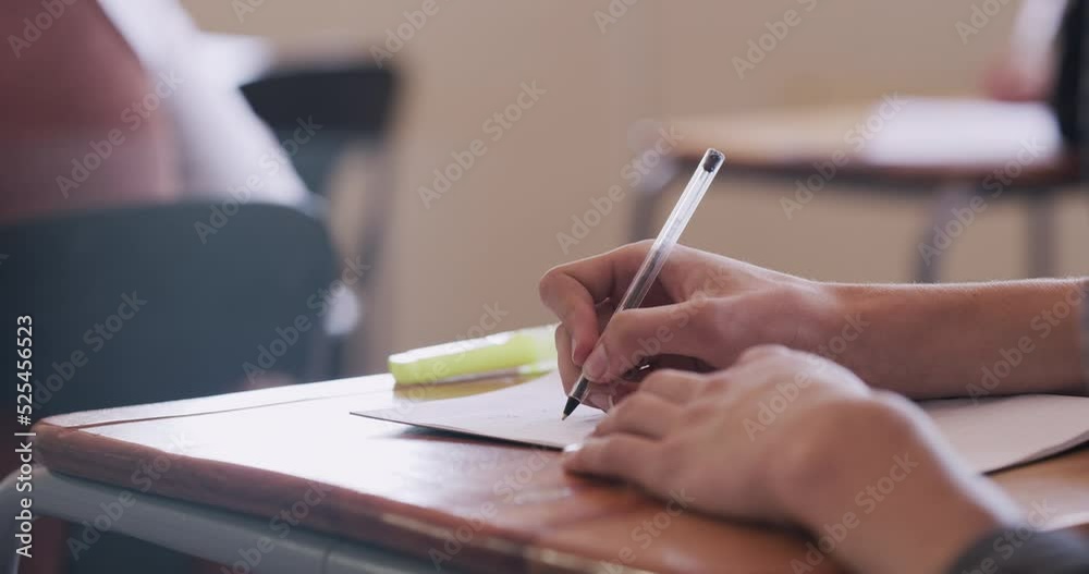 Poster Student hands writing and learning in classroom book or notebook for test or exam at school. University or college learner with education scholarship working and studying at a desk or table in class