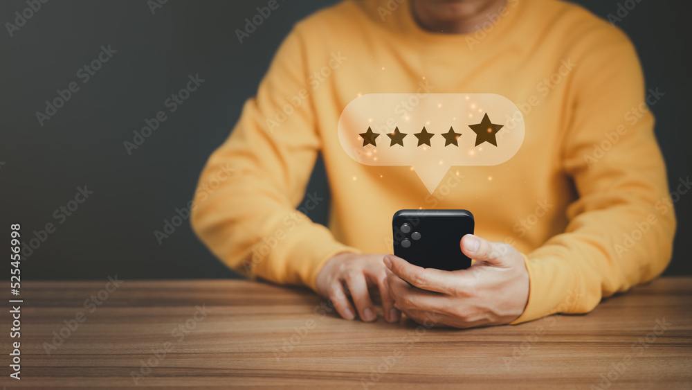 Poster Man using a smartphone in give rating to service experience on application. Online customer review satisfaction feedback survey and testimonial.