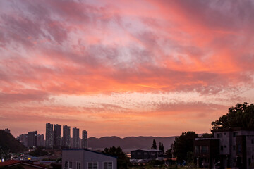 Dramatic pink and purple sunset clouds sky over the South Korea rural countryside 
