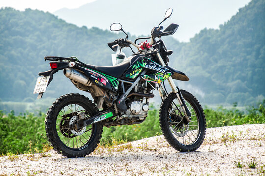 Motorcycle Kawasaki DTK125 Motocross of tourists parked on the mountain beautifully on September 24, 2022, Ban Na San District Surat Thani Province, Thailand