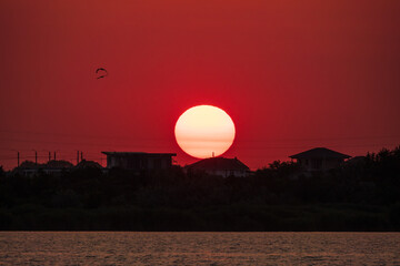 The sun goes down over a lake