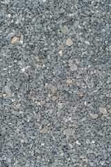 White crushed stones texture background. Gray rubble construction rock pebble pattern. 