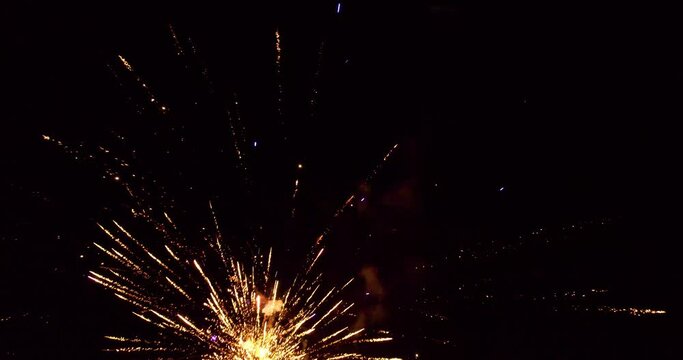 Close aerial footage of fireworks being shot into the sky.