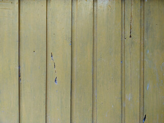 old Wooden panel texture with defects by nature old painted yellow color