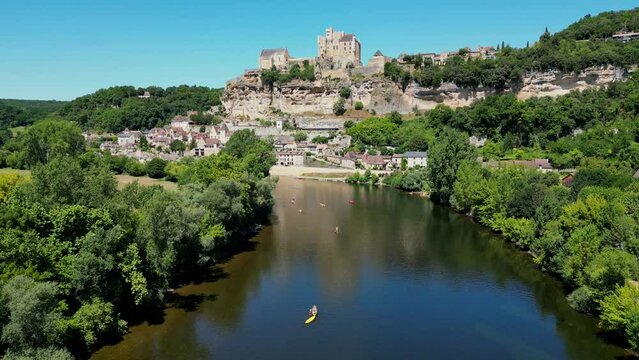 Aerial view Beynac castle and canoes on the river dordogne perigord France, High quality video