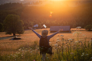 Joyful female tourist relaxing in nature