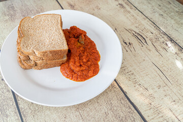 Slices of Bread served with nigerian pepper stew