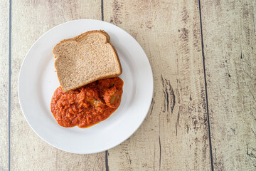 Slices of Bread served with nigerian pepper stew