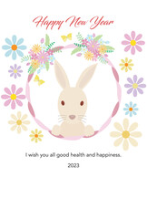 Fototapeta premium 花の飾り付きのリボンのフレームの中にいるうさぎ、フレーム周りに花を置いたイラスト（賀詞・添え書きあり）