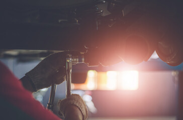 Mechanic repairing a car - 525475731