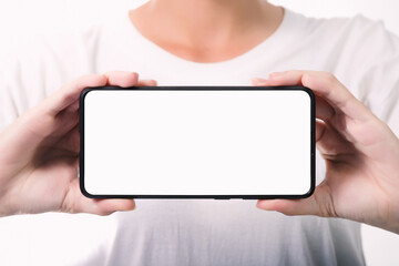 Woman hand holding the black smartphone with blank screen  isolated on white background