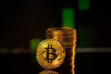 Cryptocurrency concept. Bitcoin with dark stock chart background