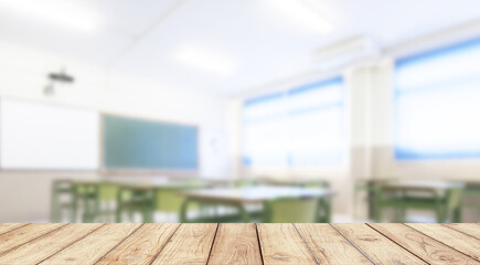 Empty wooden desk space platform with school classroom background for product display