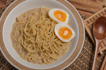 Udon and egg Japanese food with chopsticks and copy space