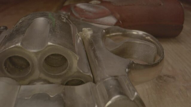 macro dolly of an beautiful old .357 magnum revolver on a wooden table