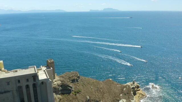 Aerial View of Fast Boats on the Mediterranean Sea with Famous Capri Island in Background