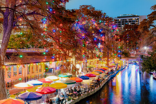 Colorful LED Christmas lights at the restaurants at the  San Antonio Riverwalk on a December Texas evening