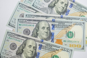 Obraz na płótnie Canvas Texture of US dollars. Background of one hundred dollar bills