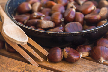 roasted or fried chestnuts in the pan on the table