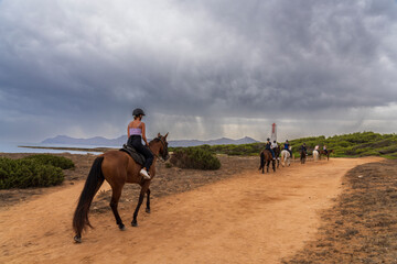 riders on the coast, Son Real, Majorca, Balearic Islands, Spain