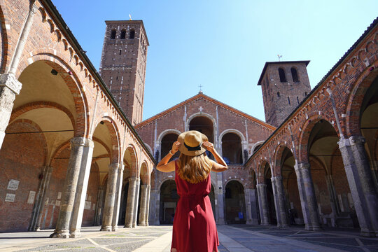 Tourism in Milan. Rear view of tourist woman visiting St. Ambrose Basilica in Milan, Italy.