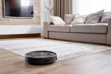 Robotic vacuum cleaner on a floor in cozy modern living room