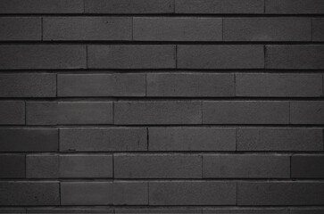 Black brick tile wall texture background. Stylish and modern exterior or interior backdrop design.