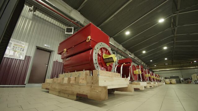 New industrial electric motors on wooden pallets. Preparing for preventive maintenance and equipment upgrades