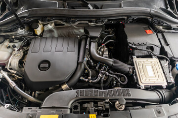 Fototapeta premium modern car engine under hood close up detail