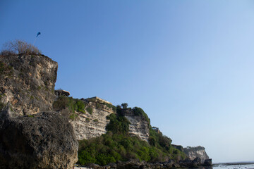 Sturdy coral cliffs are on the coast of Suluban, Bali Island