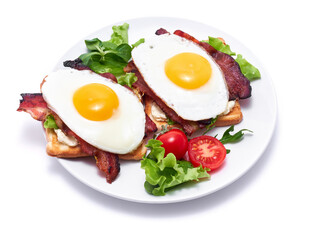 French toasts with fried eggs, cream cheese, salad and bacon