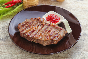 Grilled rib-eye steak beef meat
