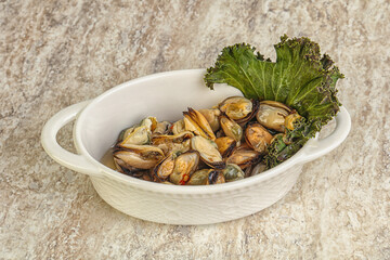 Tasty marinated mussels in the bowl