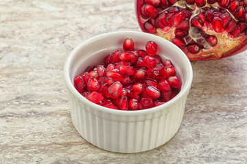 Ripe red Pomegranate seeds in the bowl