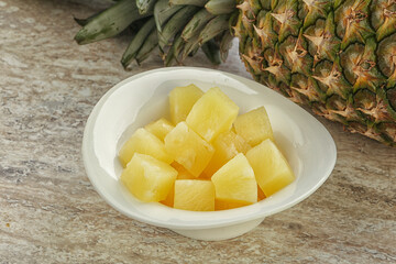 Marinated pineapple slices in the bowl