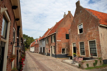 Fototapeta na wymiar Traditional historic medieval houses in the old picturesque fortified town of Elburg, Gelderland, Netherlands