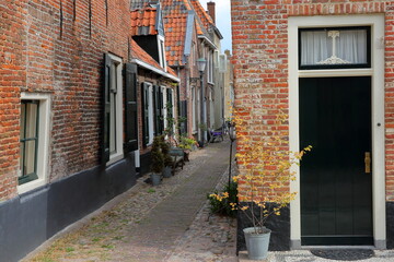 Traditional historic medieval houses in the old picturesque fortified town of Elburg, Gelderland, Netherlands