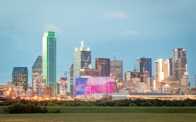 Colorful downtown Dallas Texas city skyline on a cloudy blue evening
