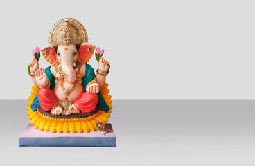 Hindu God Ganesha on light grey background, Ganesha Idol. Ganesh festival. - obrazy, fototapety, plakaty