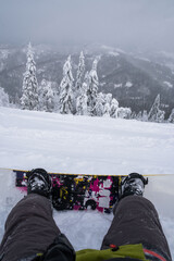 Fototapeta na wymiar snowboarder at the hill enjoying mountains landscape