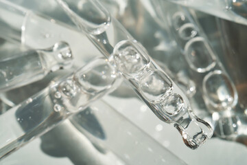 There are a lot of pipettes from cosmetics in one photo.