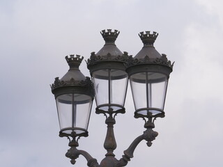 Fototapeta na wymiar Close up of a parisian street lamp by daylight