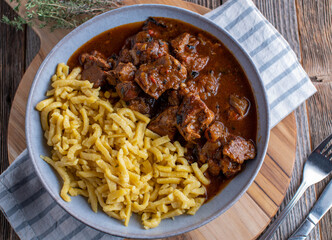 Hungarian goulash with spaetzle noodles on a plate