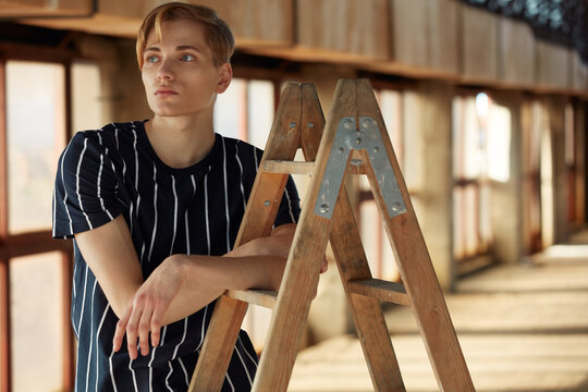 Young choreographer posing on stepladder